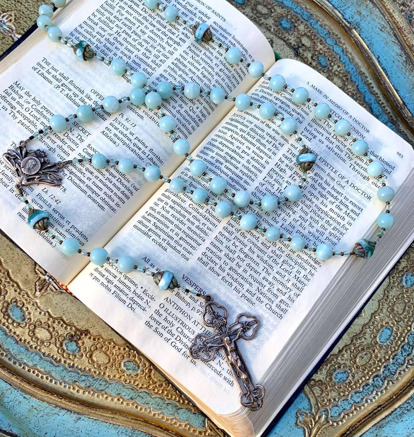 Close-up of natural mint green Amazonite gemstone beads on handmade Catholic rosary