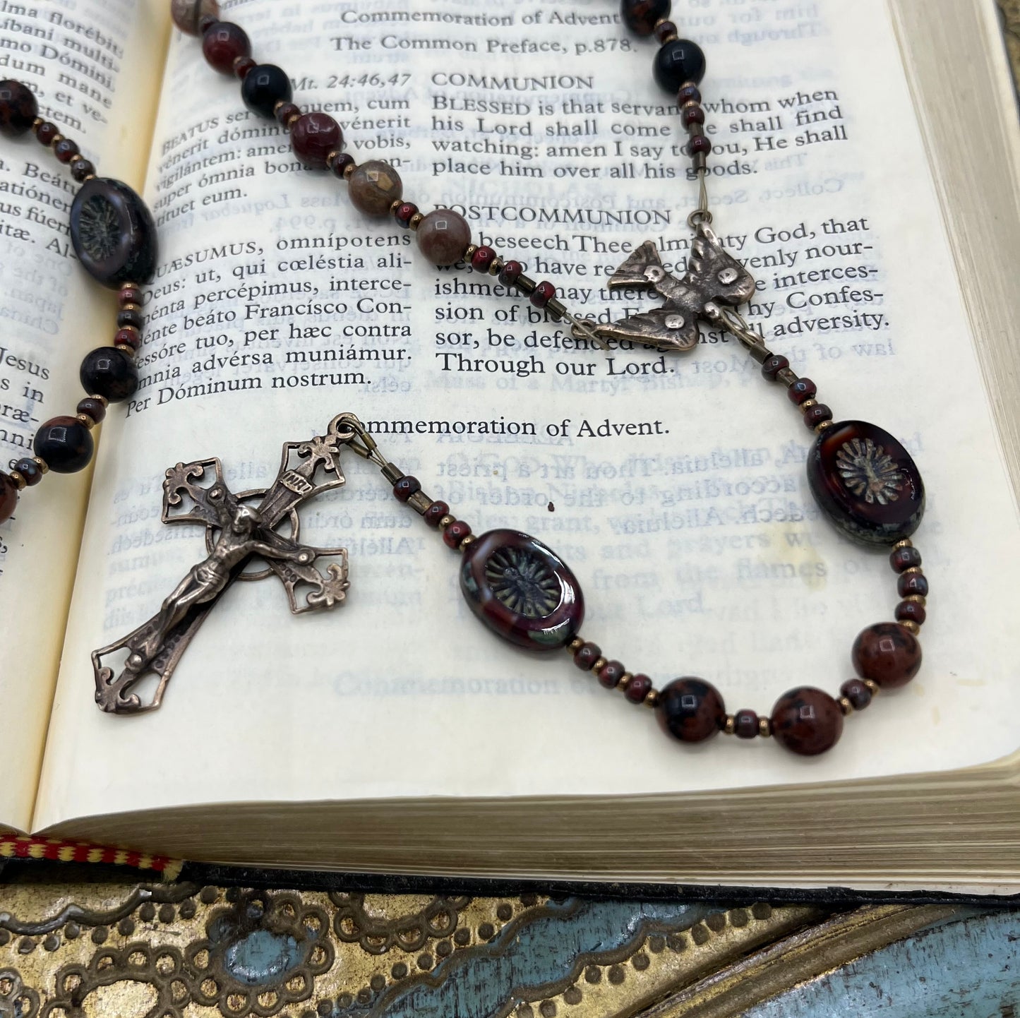 Close up of natural Brecciated Jasper gemstone beads showing subtle variations.  And the Czech Pressed Glass Paters with a unique design that truly sets this handmade Catholic rosary apart 