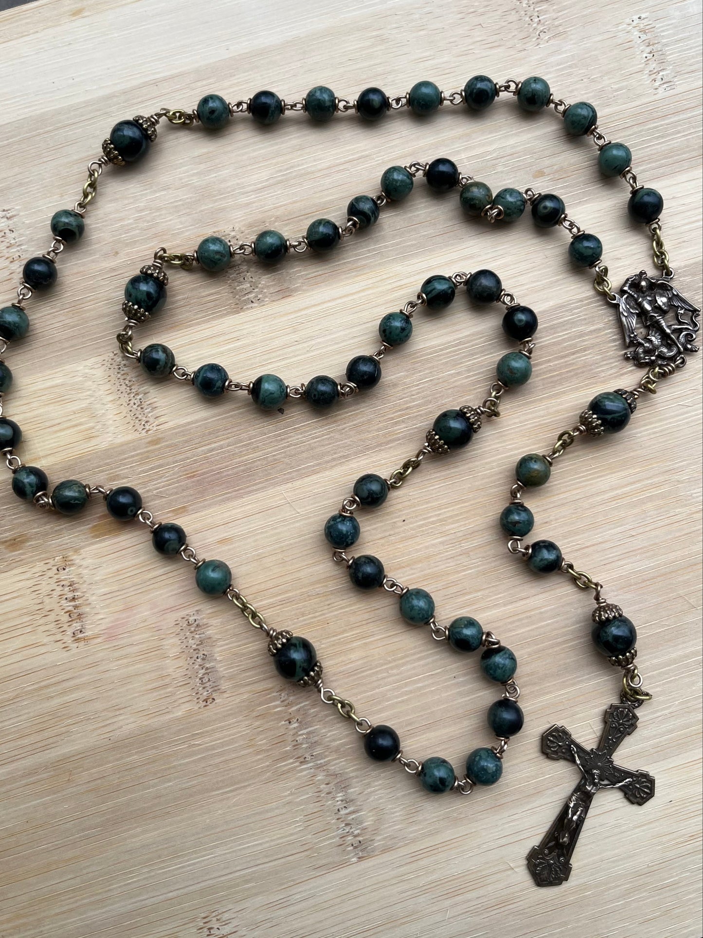 Green & Black Kambaba Jasper rosary with bronze metal cross on a and St Michael center