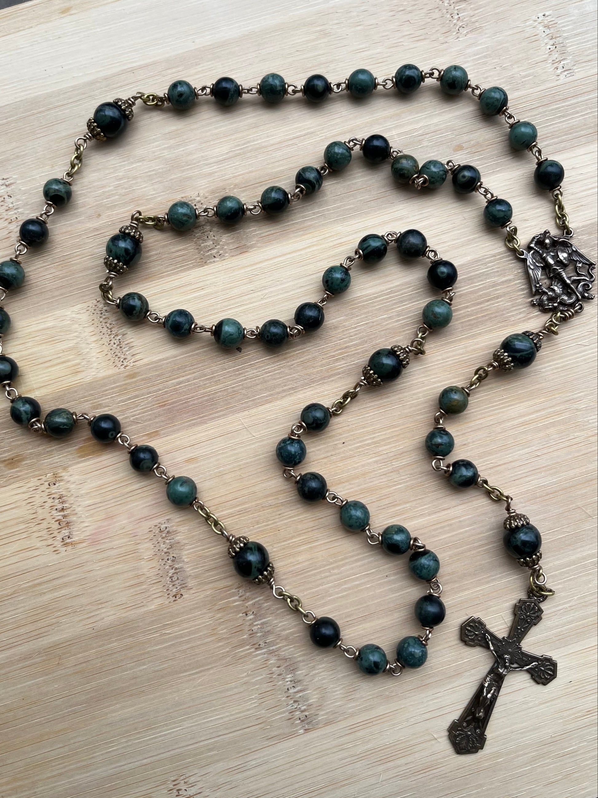 Green & Black Kambaba Jasper rosary with bronze metal cross on a and St Michael center