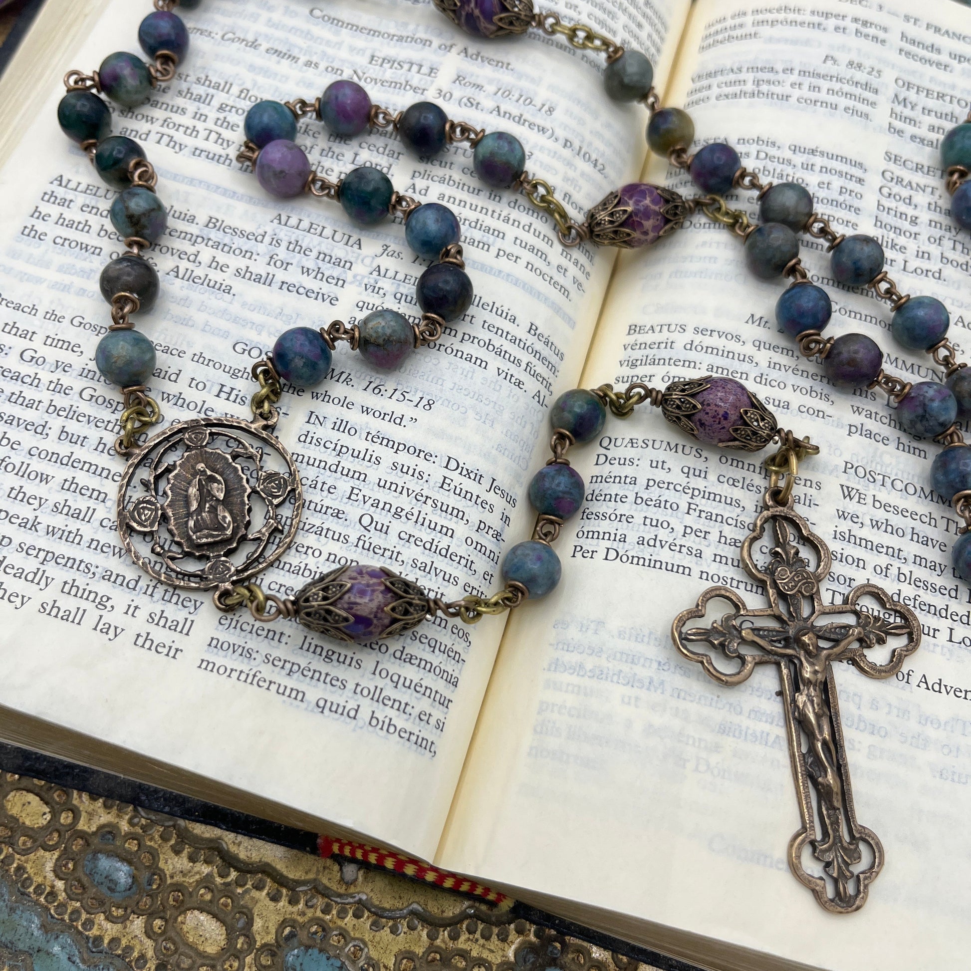 Detail of Our Lady of Guadalupe center and solid bronze crucifix on a handmade heirloom Catholic rosary