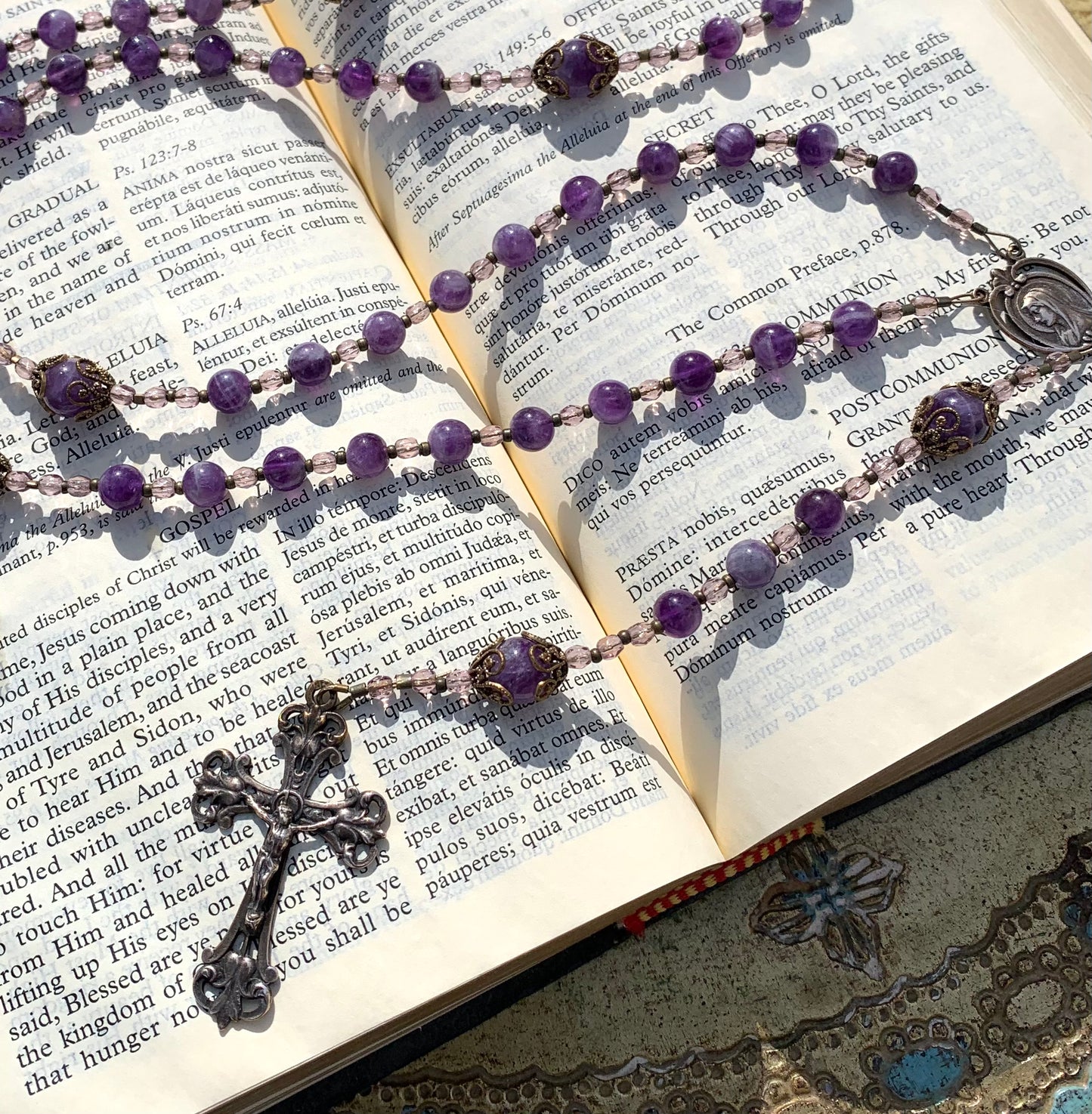 Close-up of natural Amethyst gemstone beads on handmade Catholic rosary