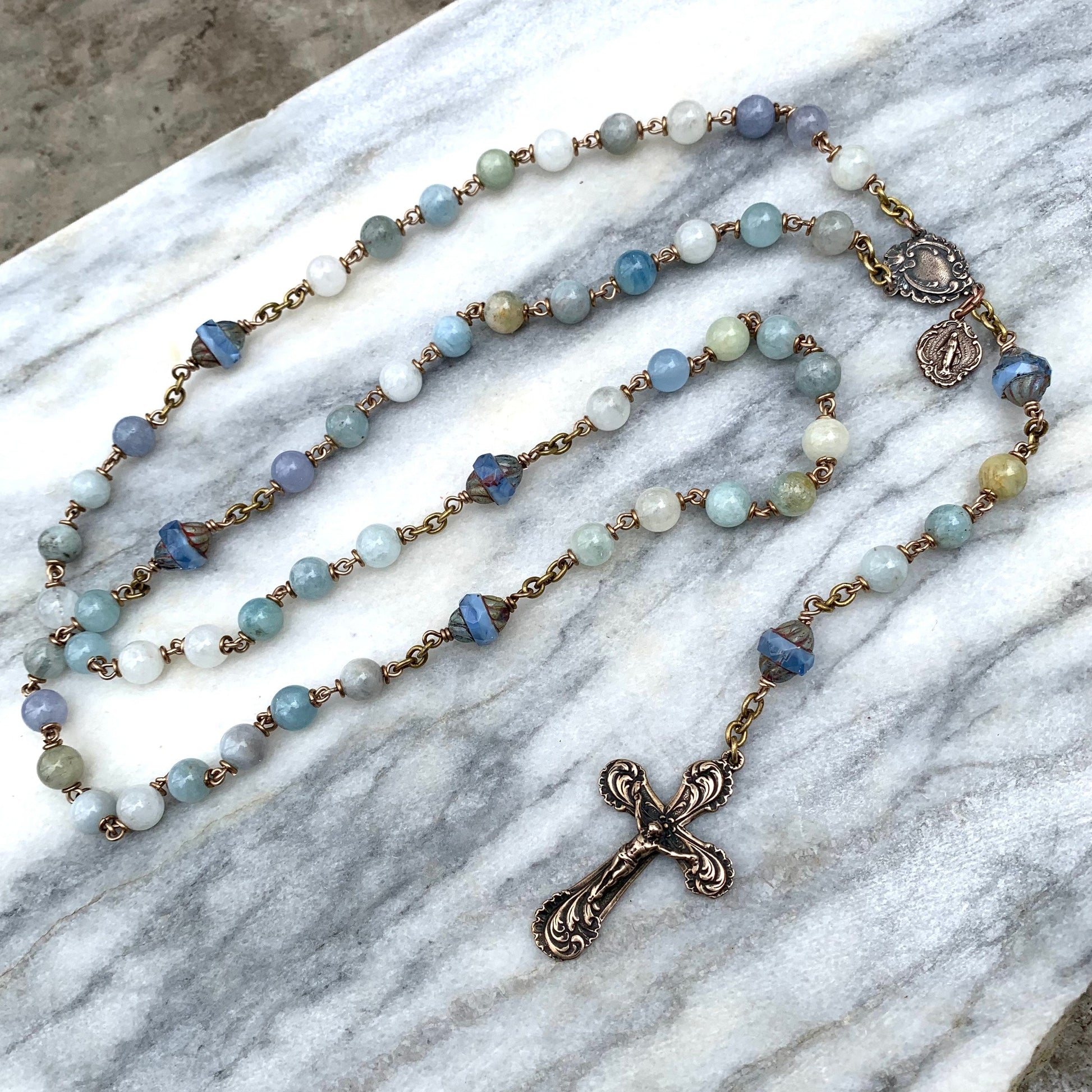 Queen of Heaven parishioners craft, donate rosaries by the thousands